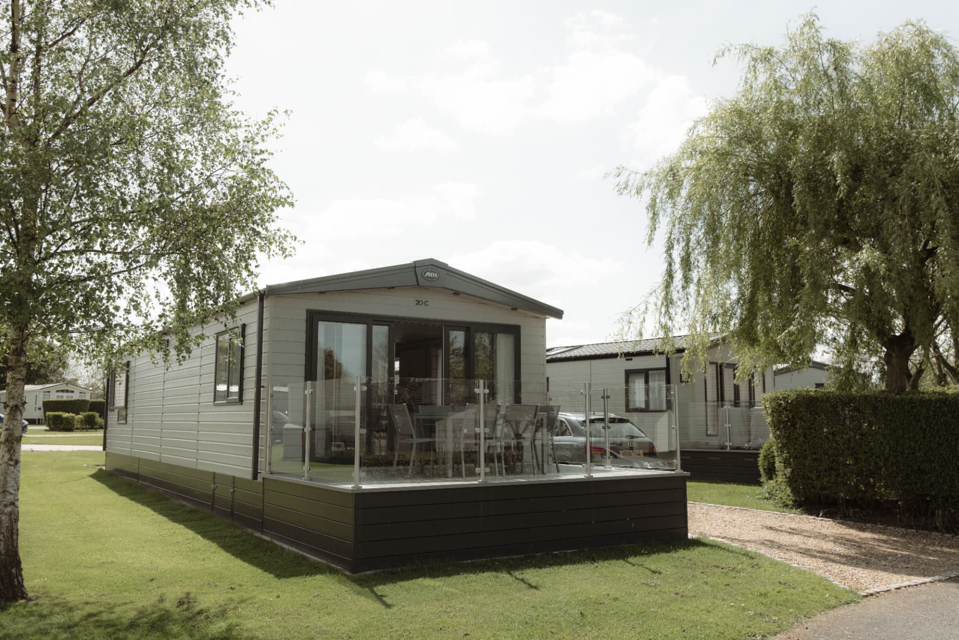 Exterior of a holiday home with contemporary cladding and glass decking
