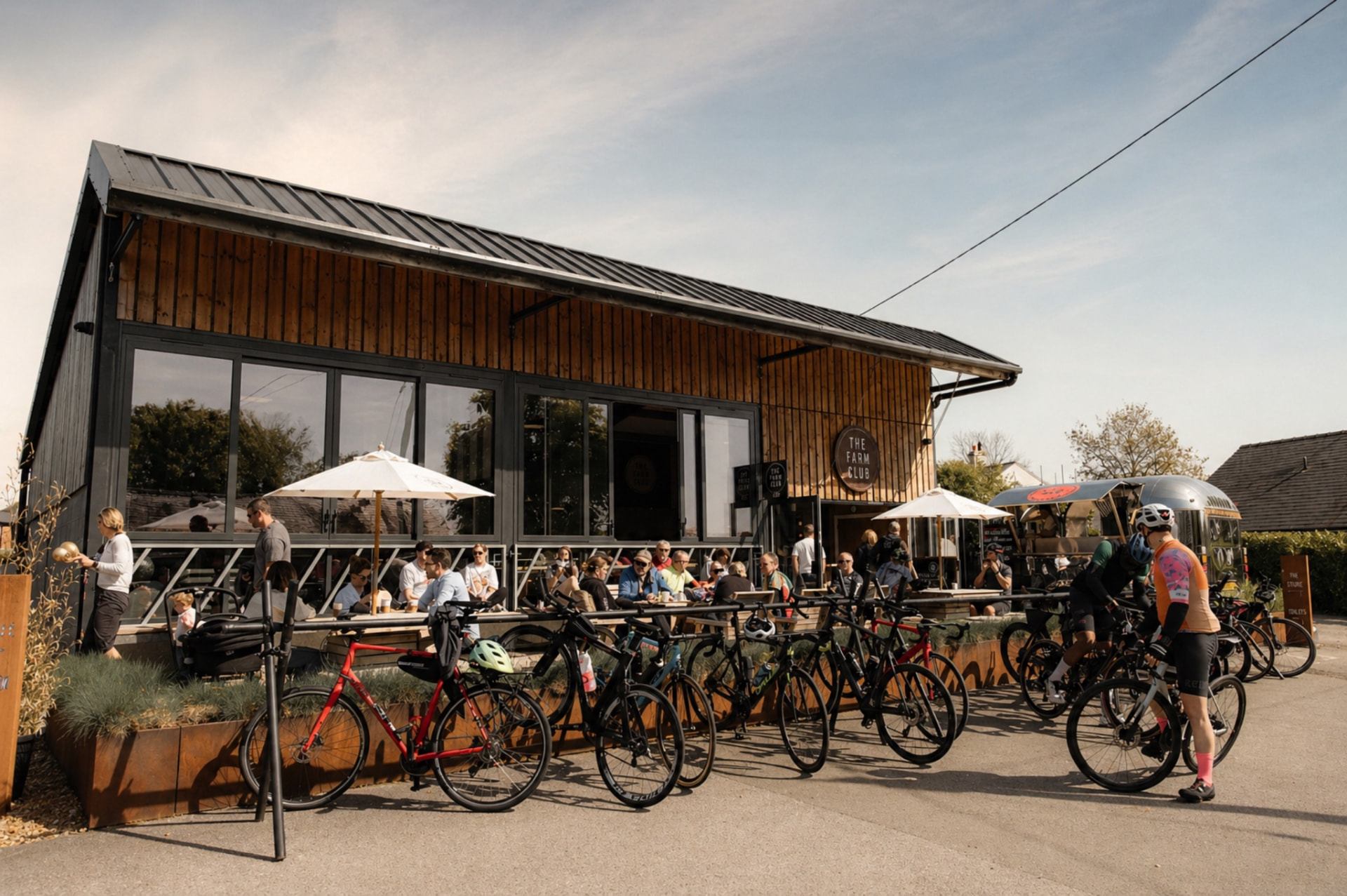 The Farm Club café and social space with owners and visitors gathered outside